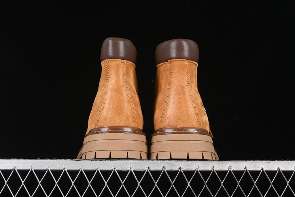 Rear view of the pair showing padded collars and lugged soles