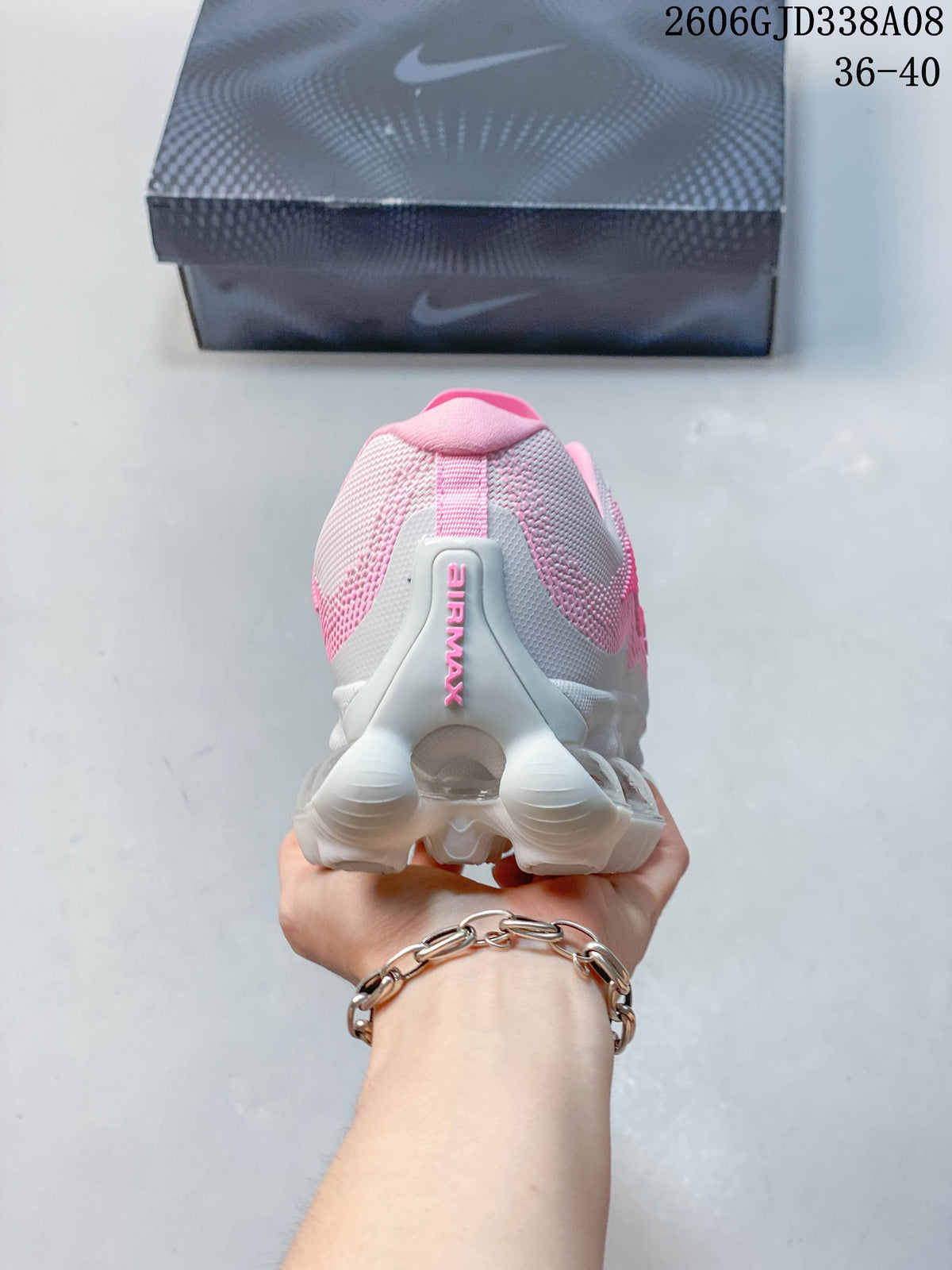 Rear view of the sneaker showing its heel and segmented sole.