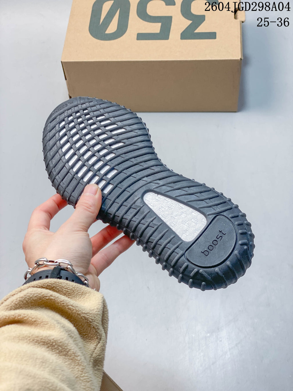 Underside of a charcoal ribbed sneaker sole