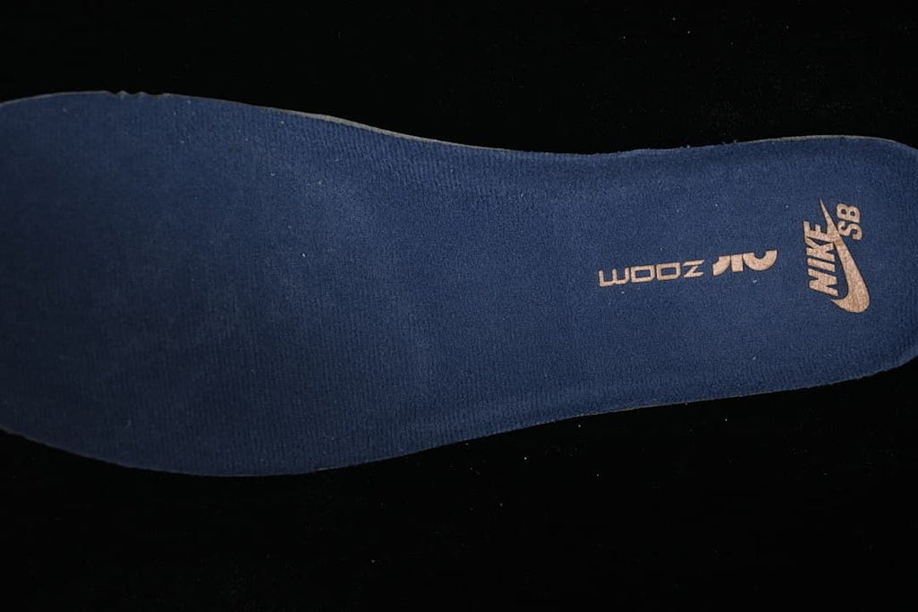 Close-up of a dark blue insole with Nike SB branding and a visible size marking.