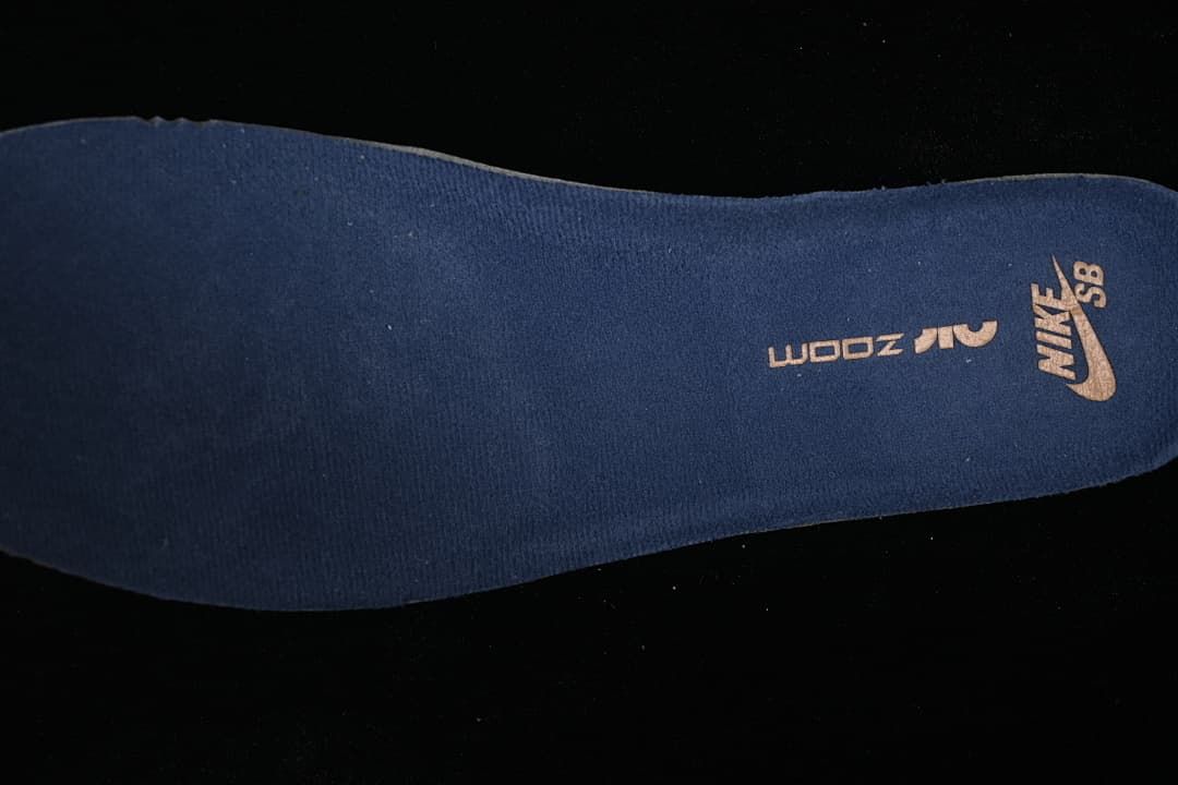 Close-up of a dark blue insole with Nike SB branding and a visible size marking.