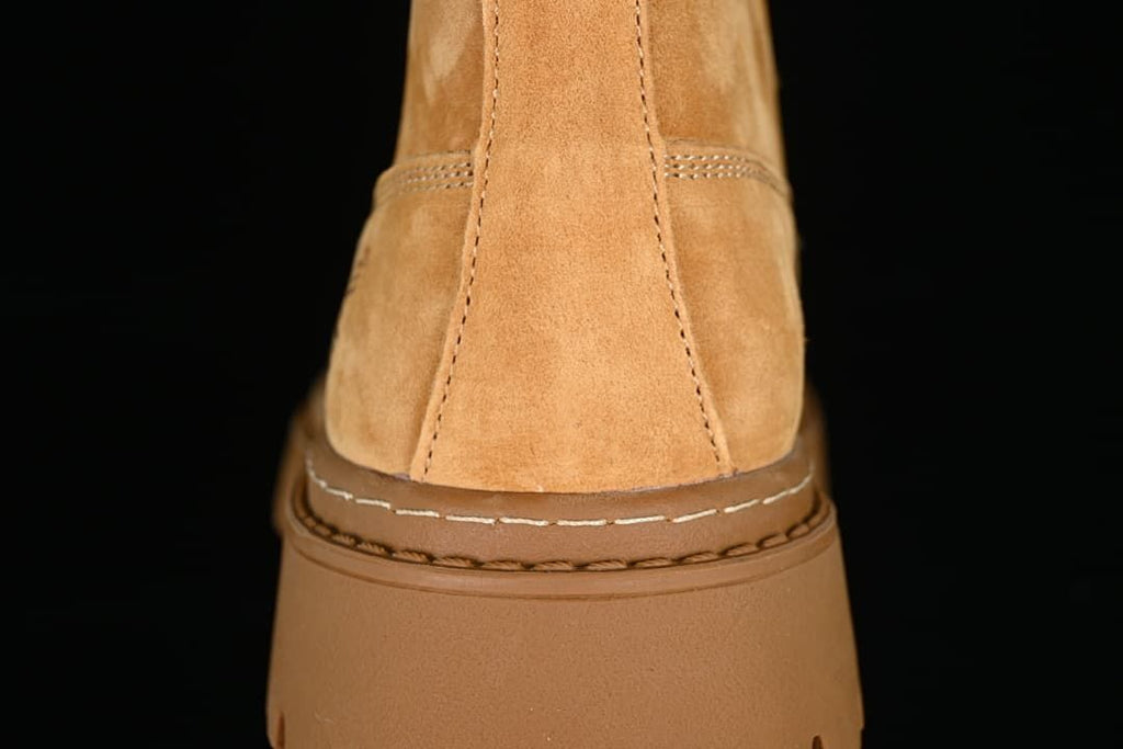 Rear view highlighting the stitched heel and raised sole