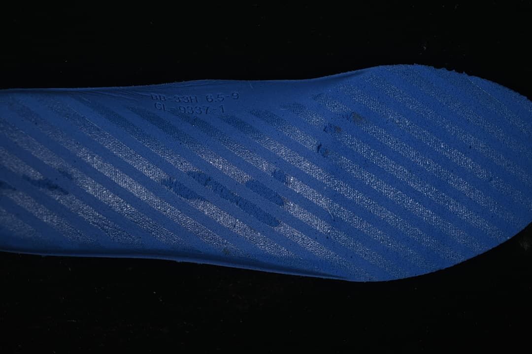 Close-up of a blue insole with printed markings