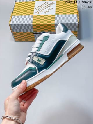 Side view showing layered green and white panels on the low-top sneaker