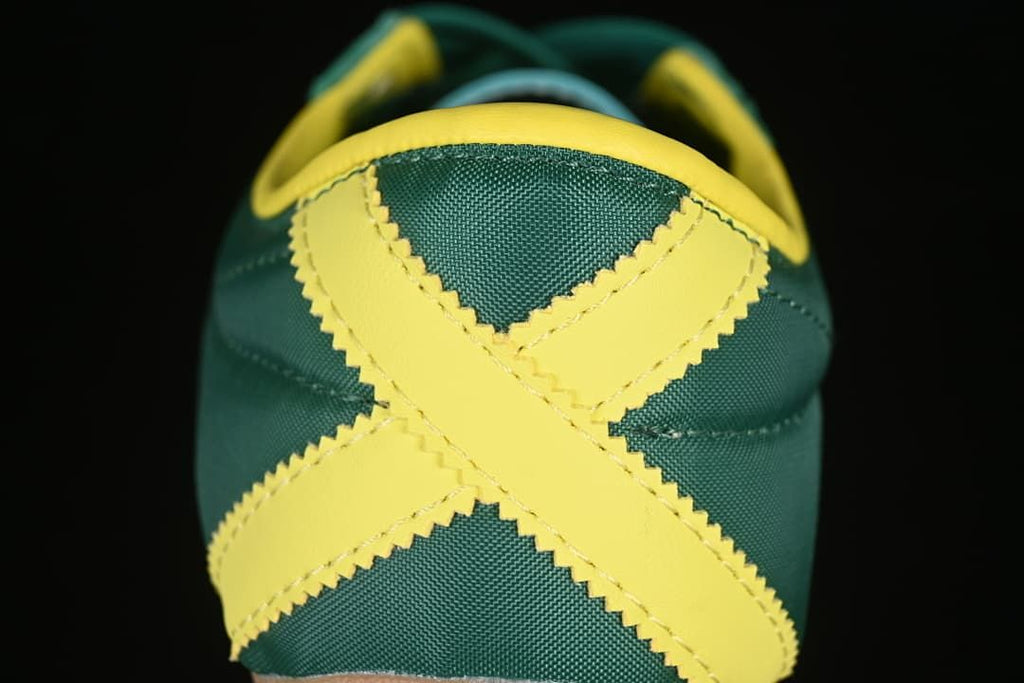 Close-up of the green heel with crossed yellow detailing