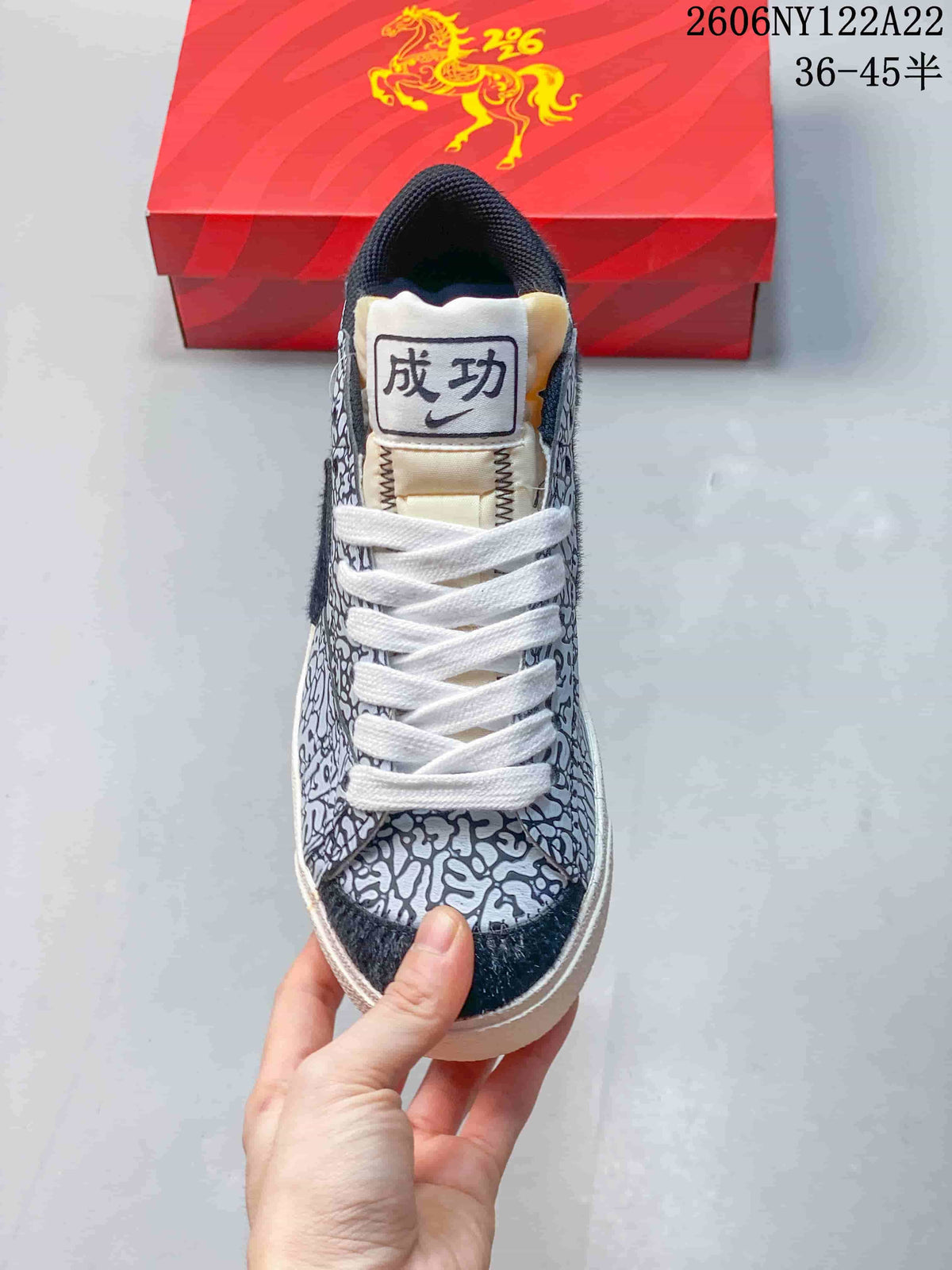 Front view showing the patterned toe, white laces, and tongue patch