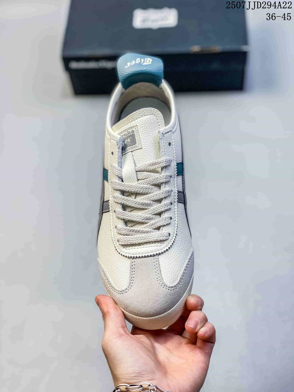 Top view of the cream lace-up sneaker with gray toe detailing and teal accents