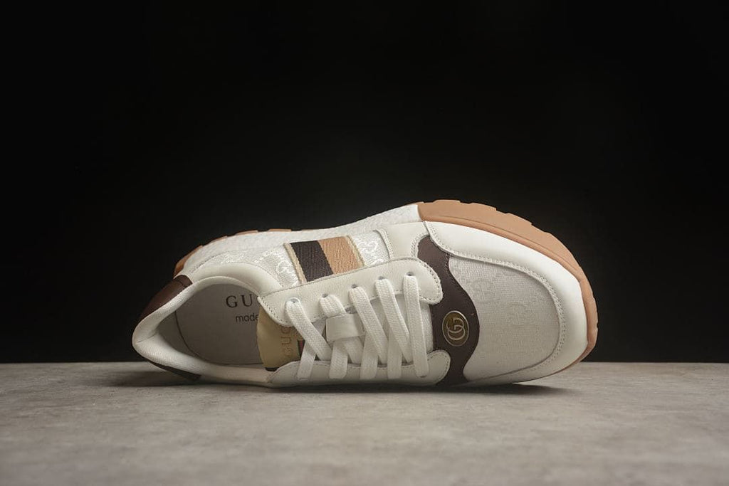 Top view of the sneaker showing the laces, tongue, and patterned panels
