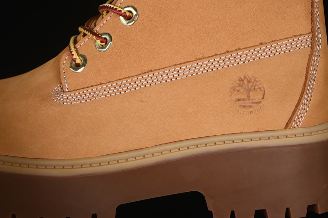 Close-up of the boot's side stitching, logo, and platform sole