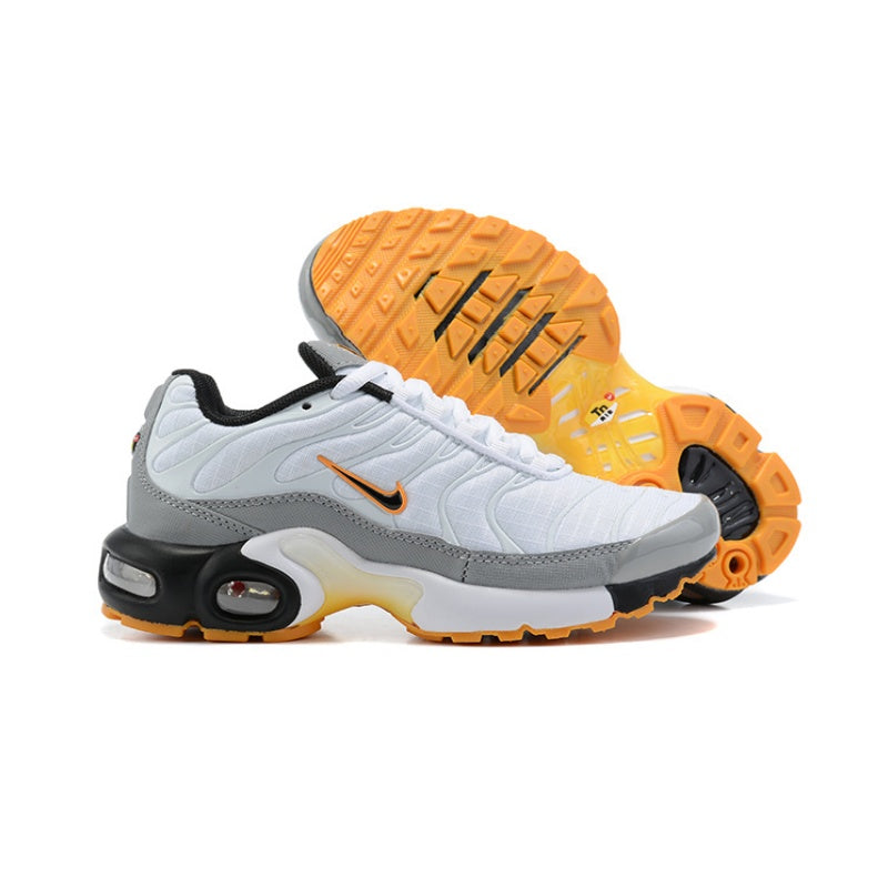White and gray Nike Air Max Plus-style sneakers with orange outsole and logo details.