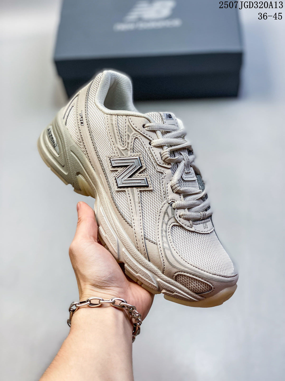 Angled side view highlighting the layered panels and New Balance logo
