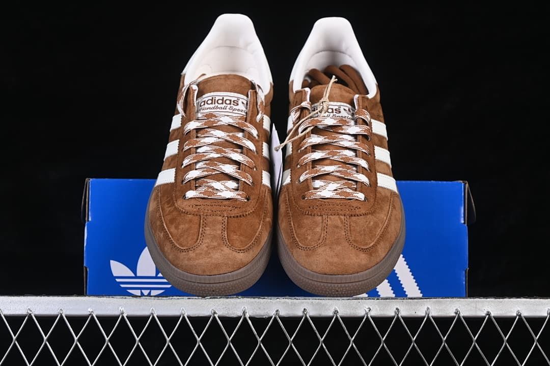 Front view of the pair displayed on a blue adidas box