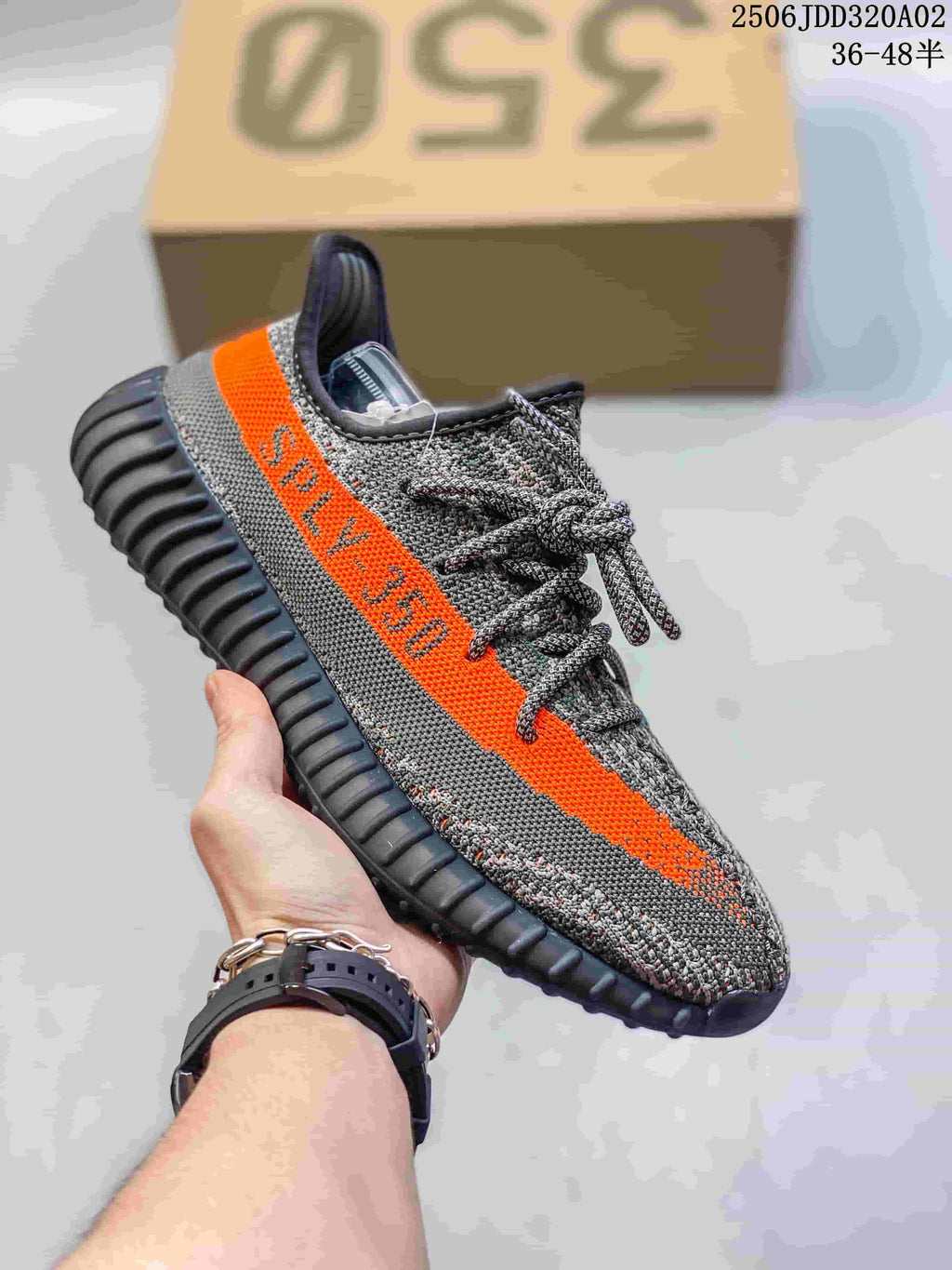 Gray knit low-top sneaker with a bright orange side stripe