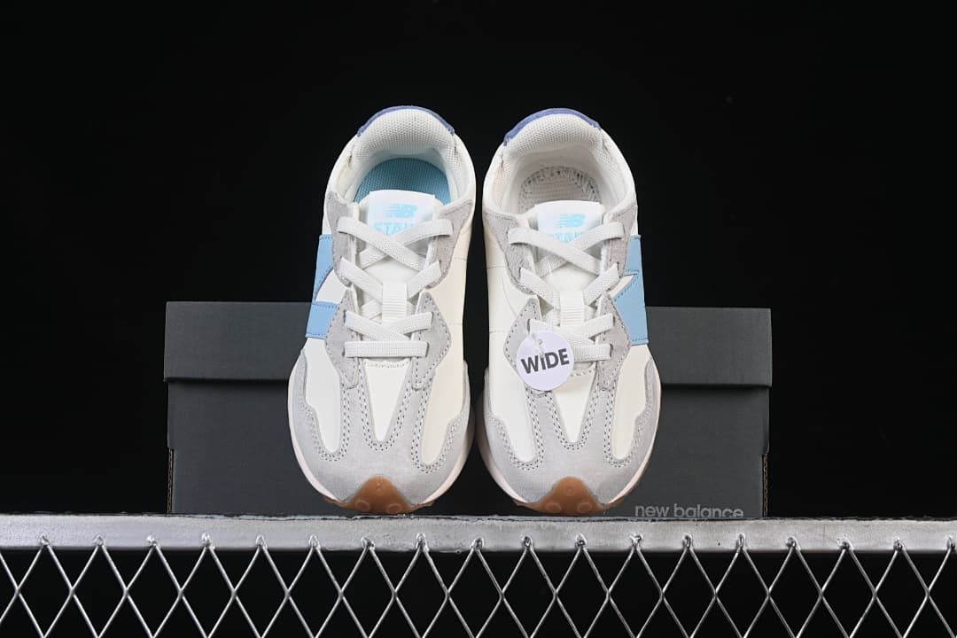 Front view of the pair displayed on the shoebox, with a WIDE tag.
