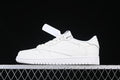Side view of a white low-top Jordan-style sneaker against a dark background.