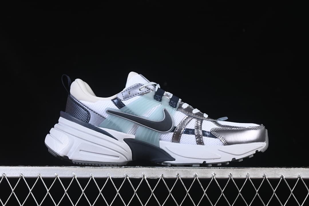 Side profile showing the sneaker's sculpted sole and layered upper.