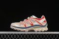 Side view of beige Salomon XT-Quest sneakers with red and slate-blue accents