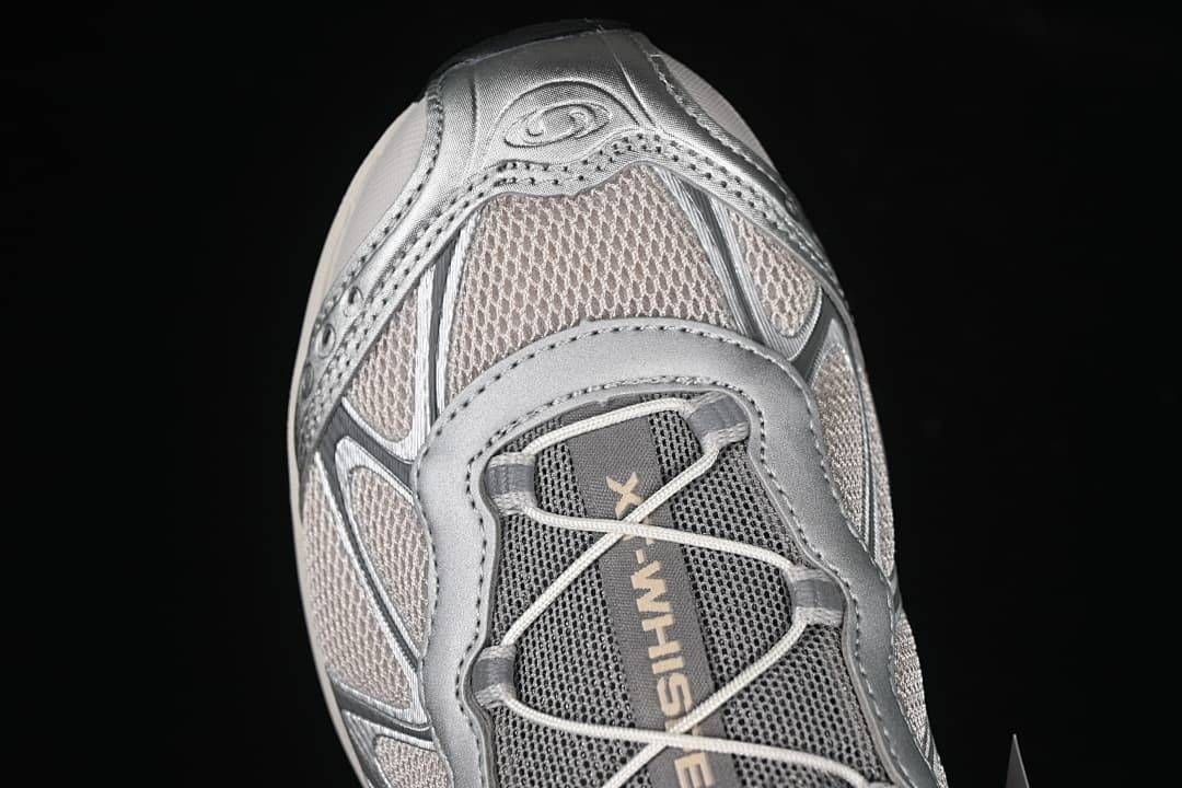 Top-down close-up of the mesh toe and lacing.