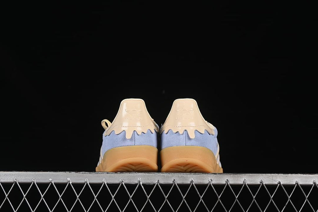 Rear view of both sneakers showing the heel details