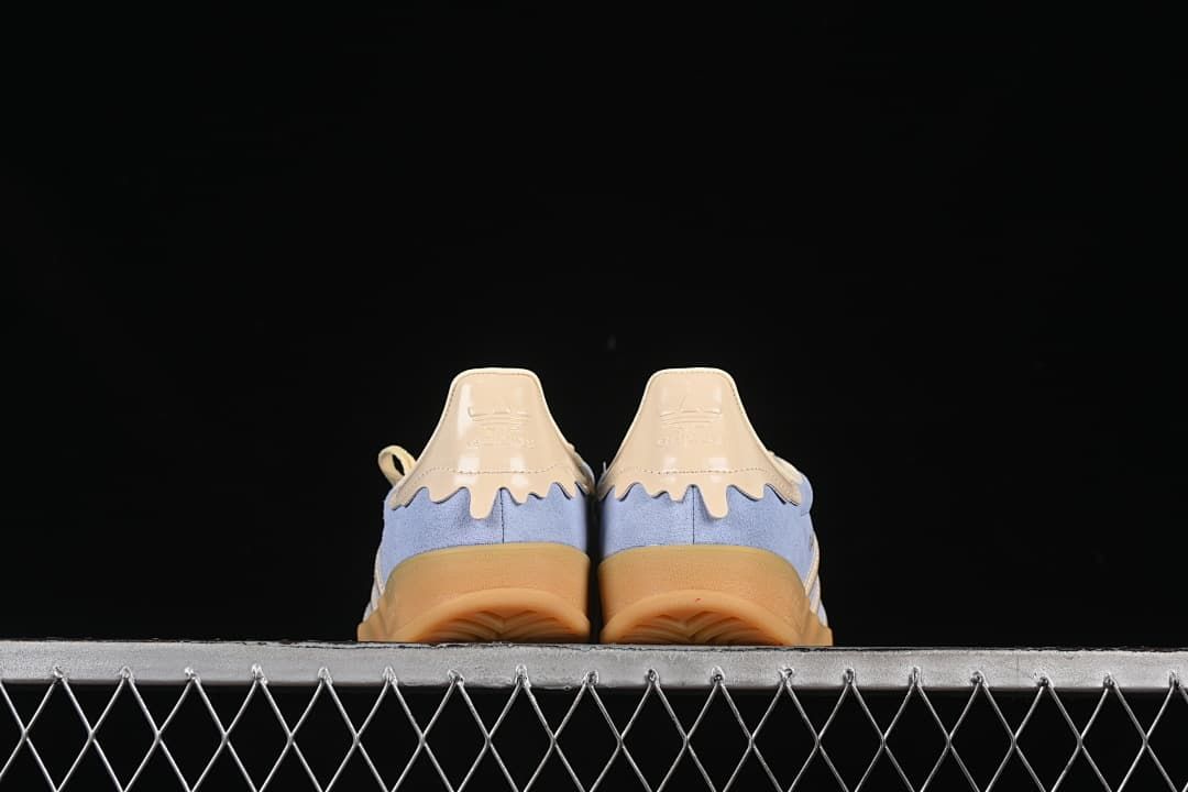 Rear view of both sneakers showing the heel details