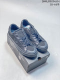Pair of charcoal Converse low-top lace-up sneakers displayed on a shoebox
